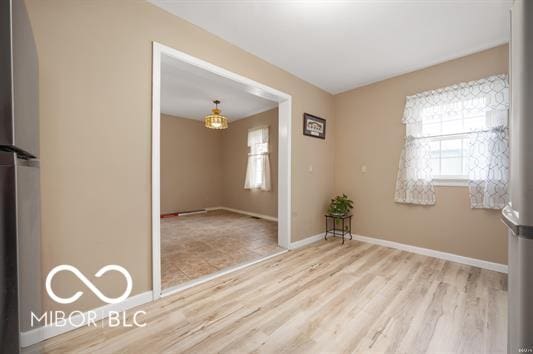 2410 S Ebright St, Muncie, IN 47302 - unfurnished room with wood finished floors and healthy amount of natural light