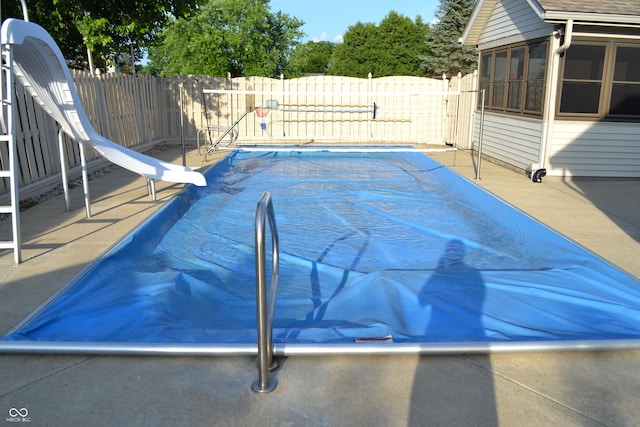 112 Marble Arch Way, Lafayette, IN 47905 - view of swimming pool featuring a water slide, a fenced backyard, and a patio