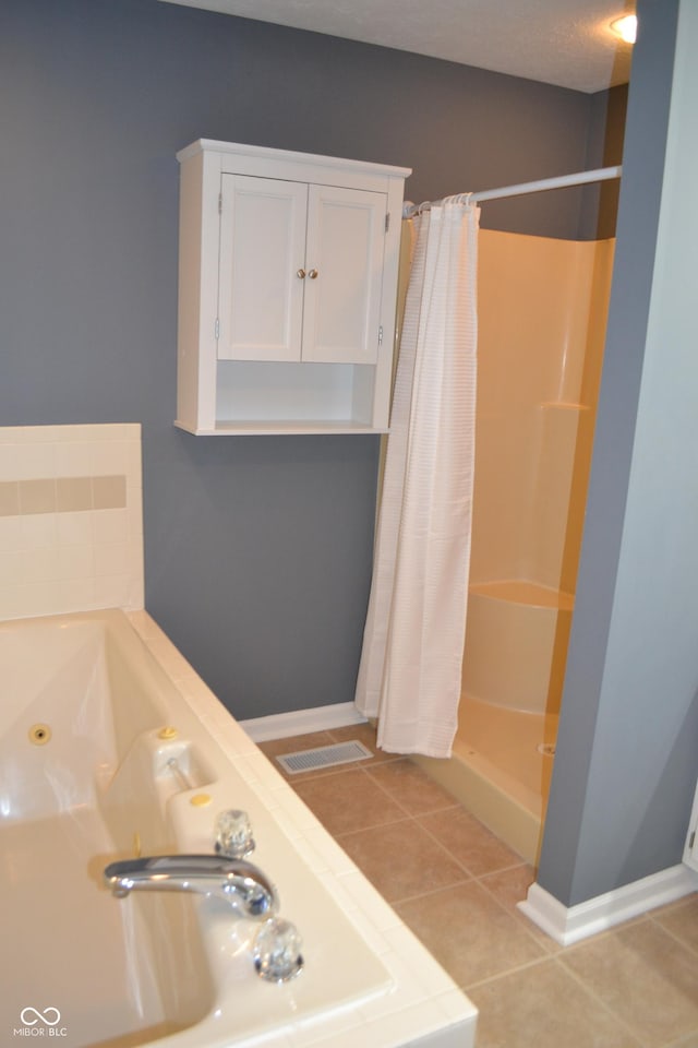 112 Marble Arch Way, Lafayette, IN 47905 - full bath featuring a stall shower, tile patterned flooring, and a tub with jets