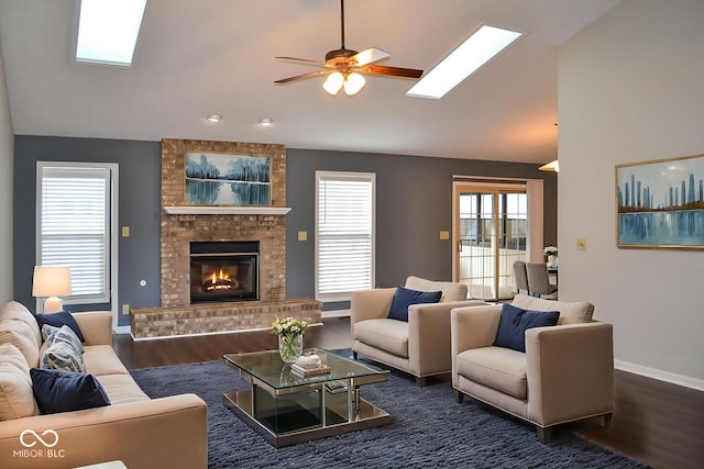 112 Marble Arch Way, Lafayette, IN 47905 - living room with wood finished floors, a skylight, a ceiling fan, a fireplace, and high vaulted ceiling