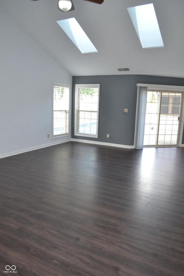 112 Marble Arch Way, Lafayette, IN 47905 - unfurnished room featuring a skylight, lofted ceiling, healthy amount of natural light, dark wood-style flooring, and a ceiling fan