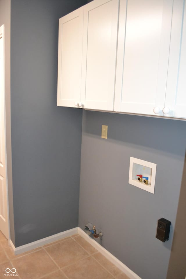 112 Marble Arch Way, Lafayette, IN 47905 - laundry area featuring hookup for a washing machine, cabinet space, light tile patterned floors, and hookup for a gas dryer