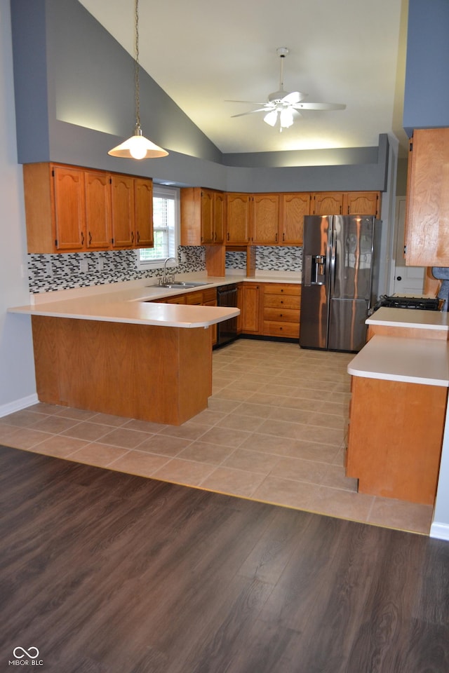 112 Marble Arch Way, Lafayette, IN 47905 - kitchen with stainless steel refrigerator with ice dispenser, a peninsula, dishwasher, brown cabinets, and light countertops