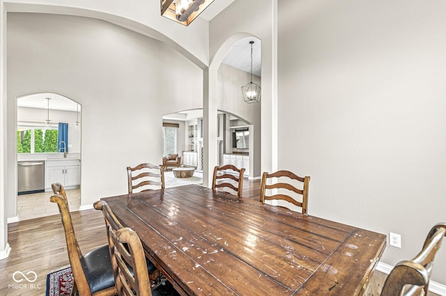 2920 Bloomsbury S, Greenwood, IN 46143 - dining room with arched walkways, wood finished floors, and a chandelier