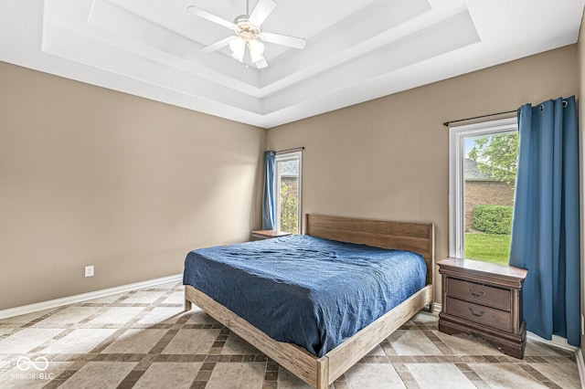 2920 Bloomsbury S, Greenwood, IN 46143 - bedroom with a tray ceiling, multiple windows, and ceiling fan