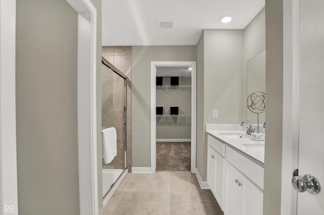 19838 Moorpark Lndg, Noblesville, IN 46062 - bathroom with a shower stall, a spacious closet, double vanity, and tile patterned flooring