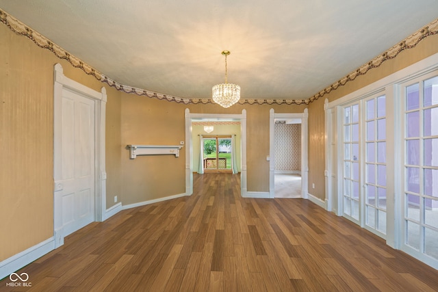 206 E Franklin St, Roachdale, IN 46172 - unfurnished dining area featuring a chandelier and wood finished floors