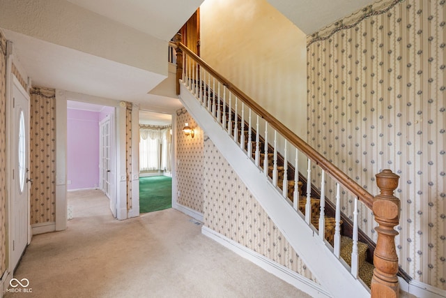 206 E Franklin St, Roachdale, IN 46172 - stairs featuring wallpapered walls and carpet flooring