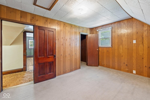 206 E Franklin St, Roachdale, IN 46172 - empty room with wood walls and carpet flooring