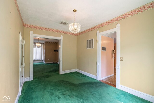 206 E Franklin St, Roachdale, IN 46172 - carpeted empty room featuring a chandelier
