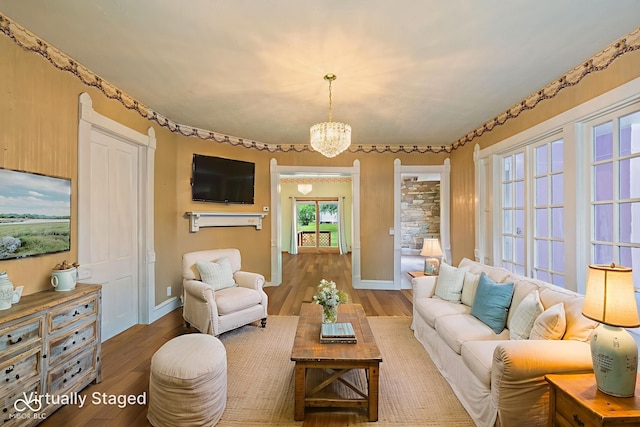 206 E Franklin St, Roachdale, IN 46172 - living area featuring wood finished floors and a chandelier