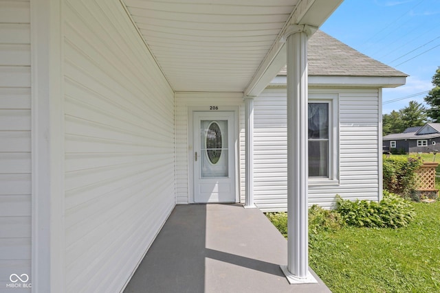 206 E Franklin St, Roachdale, IN 46172 - property entrance featuring a shingled roof