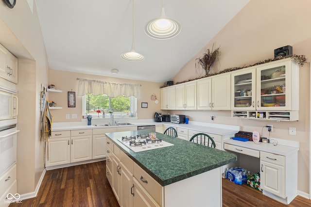 1439 E Mckenzie Rd, Greenfield, IN 46140 - kitchen featuring dark wood-type flooring, white appliances, glass insert cabinets, vaulted ceiling, and a kitchen island