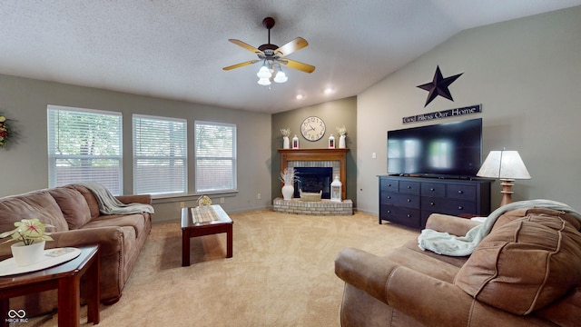 6816 Minnow Dr, Indianapolis, IN 46237 - living room featuring lofted ceiling, plenty of natural light, a ceiling fan, light colored carpet, and a brick fireplace