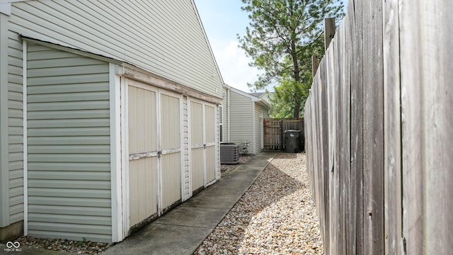 6816 Minnow Dr, Indianapolis, IN 46237 - view of home's exterior featuring a cooling unit and a storage unit