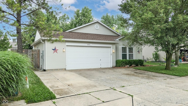 6816 Minnow Dr, Indianapolis, IN 46237 - ranch-style home featuring a garage, a shingled roof, and driveway
