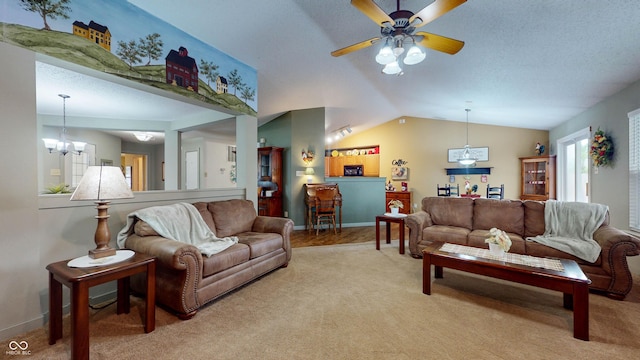 6816 Minnow Dr, Indianapolis, IN 46237 - living room featuring lofted ceiling, light colored carpet, ceiling fan, and a chandelier