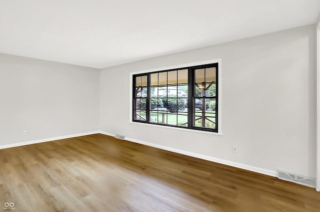 4070 Serenity Way Ct, Greenwood, IN 46142 - empty room featuring wood finished floors and baseboards