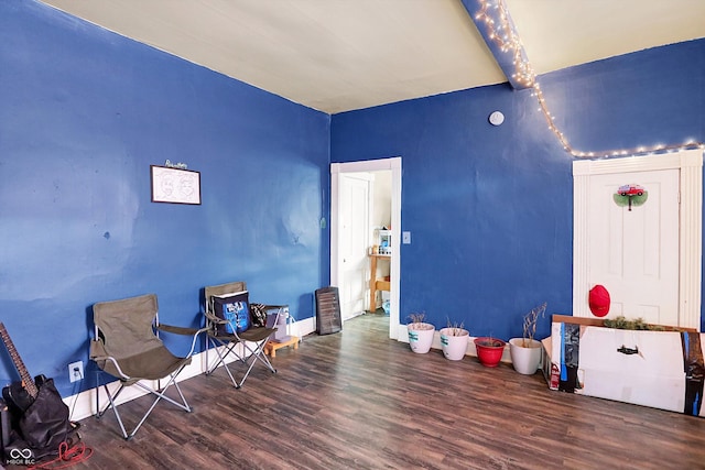 315 N High St, Hartford City, IN 47348 - living area featuring wood finished floors and beam ceiling