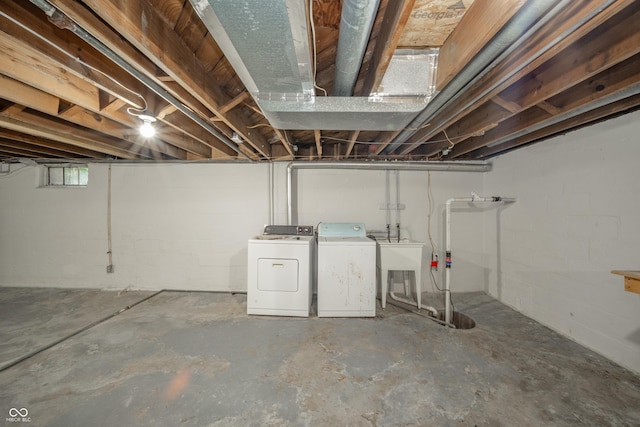 171 Nursery Rd, Anderson, IN 46012 - below grade area featuring separate washer and dryer and concrete block wall