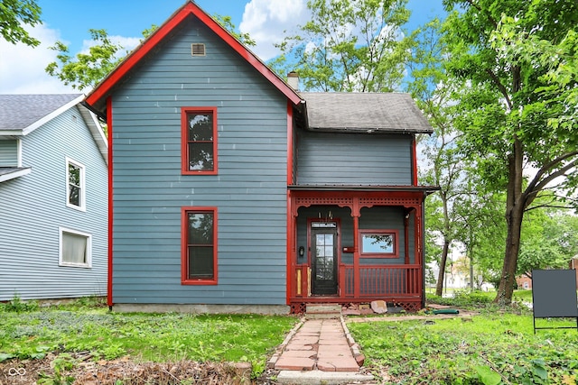 115 Simpson St, Crawfordsville, IN 47933 - view of front facade featuring a porch and a chimney
