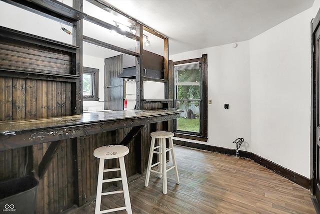 115 Simpson St, Crawfordsville, IN 47933 - kitchen with wood finished floors, healthy amount of natural light, and a breakfast bar area