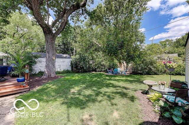 5363 Primrose Ave, Indianapolis, IN 46220 - view of green lawn featuring a wooden deck