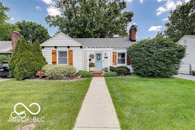 5363 Primrose Ave, Indianapolis, IN 46220 - view of front of property with a front lawn and a chimney