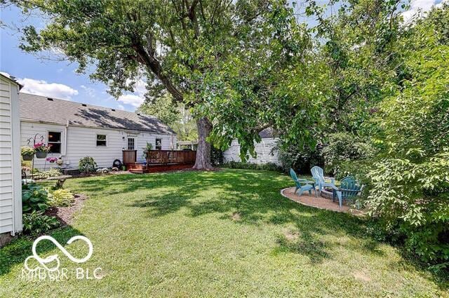 5363 Primrose Ave, Indianapolis, IN 46220 - view of green lawn featuring a deck
