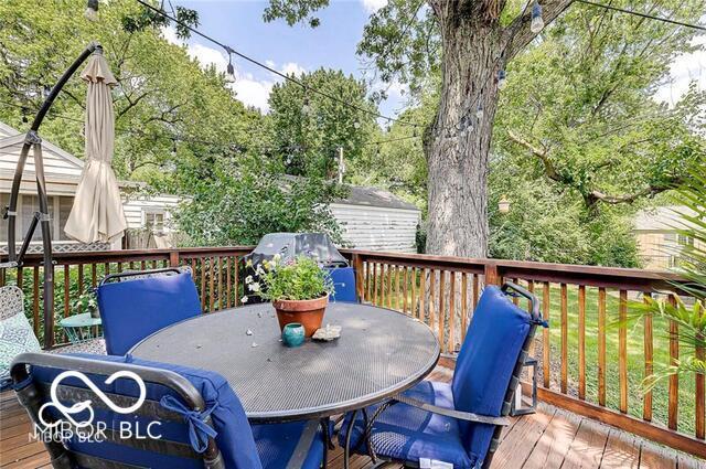 5363 Primrose Ave, Indianapolis, IN 46220 - wooden terrace featuring outdoor dining space and area for grilling