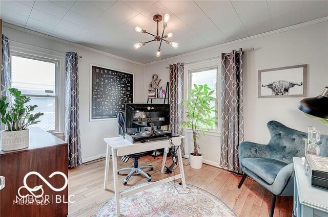 5363 Primrose Ave, Indianapolis, IN 46220 - office area with a chandelier, light wood-type flooring, and ornamental molding