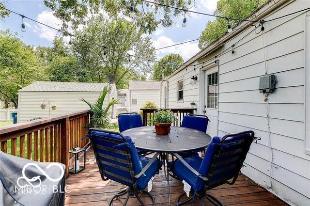 5363 Primrose Ave, Indianapolis, IN 46220 - wooden terrace with outdoor dining area