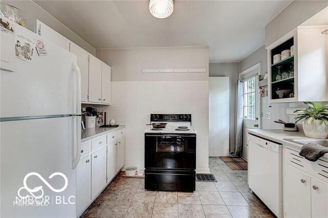 5363 Primrose Ave, Indianapolis, IN 46220 - kitchen featuring white appliances, light countertops, white cabinets, and tasteful backsplash