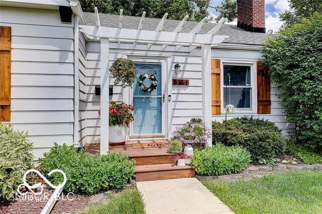 5363 Primrose Ave, Indianapolis, IN 46220 - property entrance with a chimney
