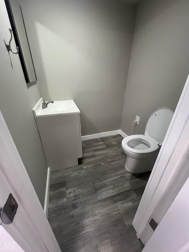 5363 Primrose Ave, Indianapolis, IN 46220 - half bathroom featuring vanity and wood finished floors