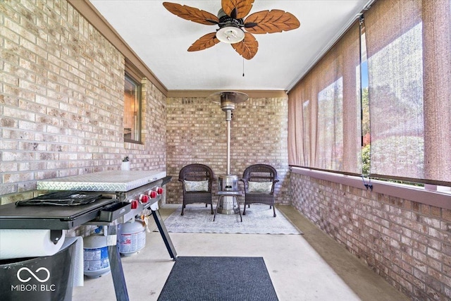 770 Viewpoint Dr, Plainfield, IN 46168 - sunroom with brick wall, ceiling fan, concrete flooring, and ornamental molding