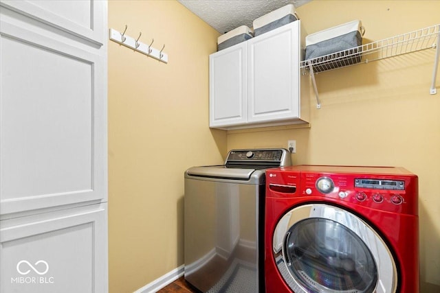 770 Viewpoint Dr, Plainfield, IN 46168 - washroom featuring cabinet space, washing machine and clothes dryer, and a textured ceiling