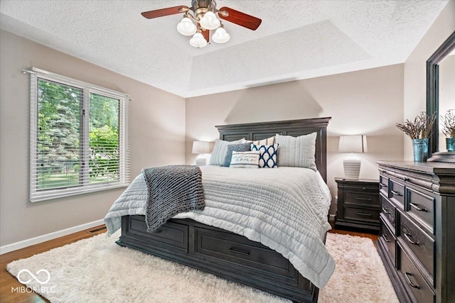 770 Viewpoint Dr, Plainfield, IN 46168 - bedroom with a textured ceiling, wood finished floors, and a ceiling fan
