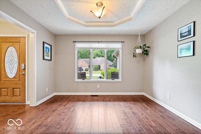 770 Viewpoint Dr, Plainfield, IN 46168 - entrance foyer with dark wood finished floors, a textured ceiling, and a tray ceiling
