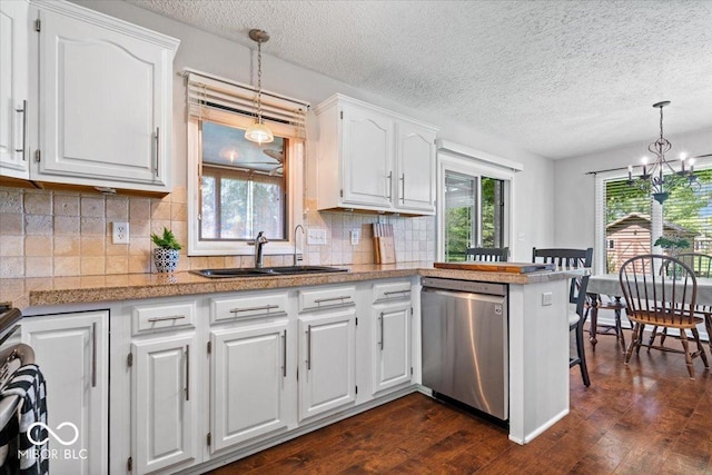 770 Viewpoint Dr, Plainfield, IN 46168 - kitchen featuring stainless steel dishwasher, a textured ceiling, dark wood-type flooring, white cabinets, and a peninsula