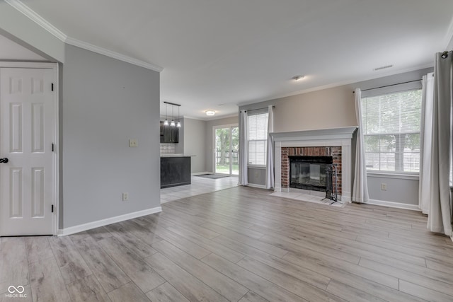 7914 Willow Wind Cir, Indianapolis, IN 46239 - unfurnished living room with a fireplace, crown molding, and light wood finished floors