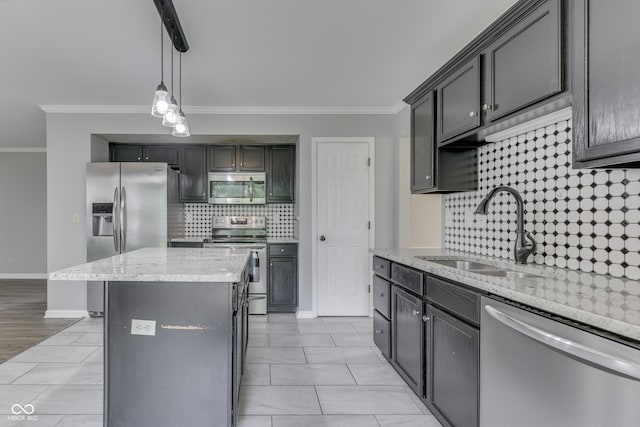 7914 Willow Wind Cir, Indianapolis, IN 46239 - kitchen with stainless steel appliances, ornamental molding, backsplash, light stone counters, and hanging light fixtures