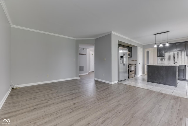 7914 Willow Wind Cir, Indianapolis, IN 46239 - unfurnished living room featuring light wood-style flooring and ornamental molding