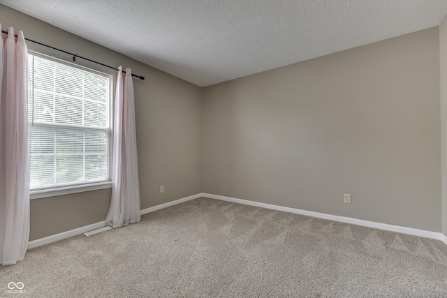7914 Willow Wind Cir, Indianapolis, IN 46239 - unfurnished room with carpet floors and a textured ceiling