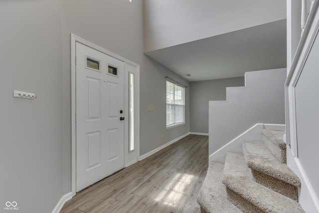 7914 Willow Wind Cir, Indianapolis, IN 46239 - entryway featuring stairs and wood finished floors