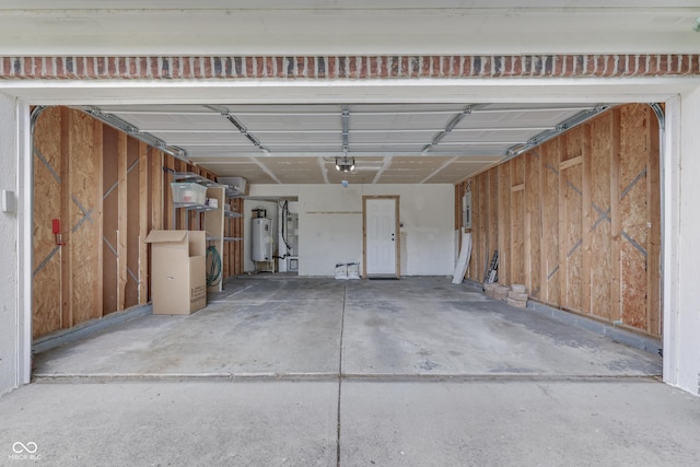 7914 Willow Wind Cir, Indianapolis, IN 46239 - garage featuring electric water heater and a garage door opener