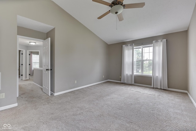 7914 Willow Wind Cir, Indianapolis, IN 46239 - empty room featuring lofted ceiling, healthy amount of natural light, carpet floors, and ceiling fan