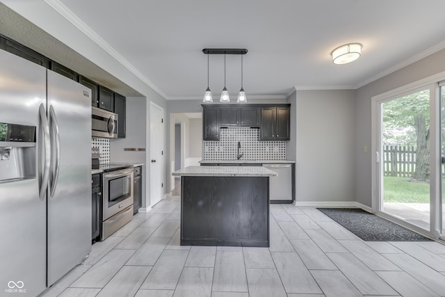 7914 Willow Wind Cir, Indianapolis, IN 46239 - kitchen with appliances with stainless steel finishes, tasteful backsplash, a center island, ornamental molding, and pendant lighting