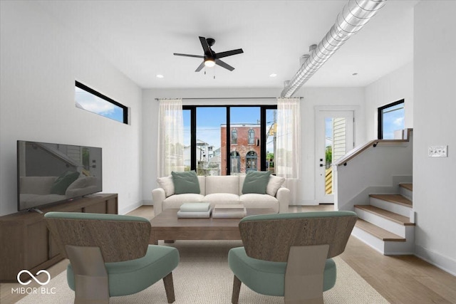 1100 English Ave, Indianapolis, IN 46203 - living area featuring ceiling fan, light wood-style floors, stairway, and recessed lighting