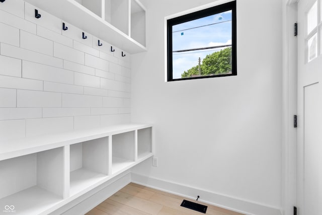 1100 English Ave, Indianapolis, IN 46203 - mudroom with baseboards and light wood finished floors